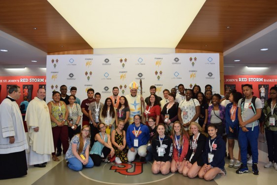 Bishop Nicholas DiMarzio poses with diocesan youth after a June 25 morning Mass, which was part of the Steubenville NYC Conference.