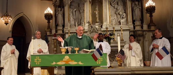  With French and American flags on the Communion rail, Bishop Nicholas DiMarzio was the main celebrant of a Mass at St. Agnes Church, Boerum Hill, with Brooklyn’s French community to pray for the victims of the terrorist attack in Nice, France. Photo © Antonina Zielinska