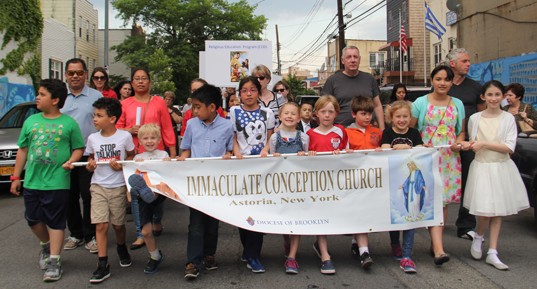  Parishioners of Immaculate Conception, Astoria, participate in a Year of Mercy procession to the Holy Doors at Our Lady of Mount Carmel Church.