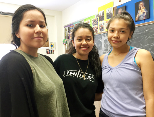 Cindy Giron, center, is attending World Youth Day with about 30 young people from Presentation B.V.M., Jamaica, including Jessica Sanchez, at left, and Andrea Hernandez, at right.