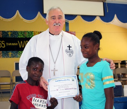 Bishop Tiedemann presents prizes to winners of the Diocesan Youth Bible Quiz held in July 2016.