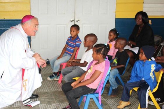 Bishop Tiedemann addresses children of the St. Anthony Kindergarten School at the blessing of their new classrooms in St. Elizabeth, Jamaica.