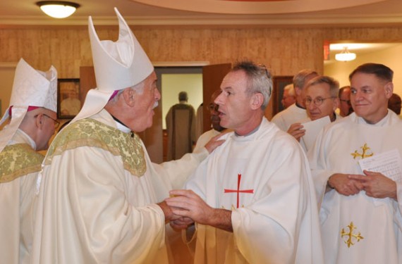 Visitation B.V.M.'s Father Eamon Murray greets Bishop Tiedemann (Photo: Ed Wilkinson)