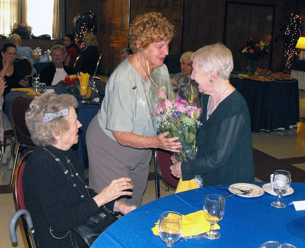  St. Catherine's Hospital School of Nursing reunion breakfast organizer Florence Clark presents flowers to Mary Brown Tuthill of the Class of 1934. (Photos: Mike Rizzo) 