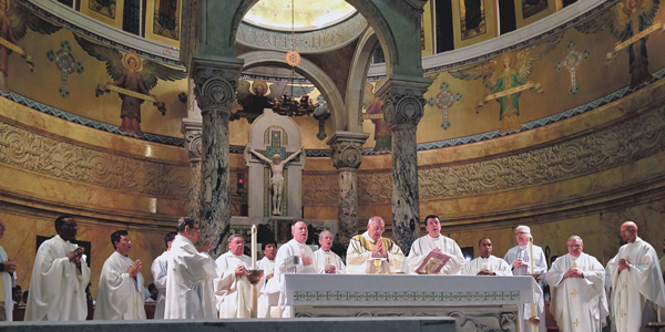 Bishop DiMarzio celebrates Mass with the priests and people of Brooklyn Deanery No. 8 at St. Michael’s Church, Sunset Park. He is flanked by Brooklyn episcopal vicar, Msgr. Joseph Grimaldi, and Father Kevin Sweeney, dean and pastor of St. Michael’s.