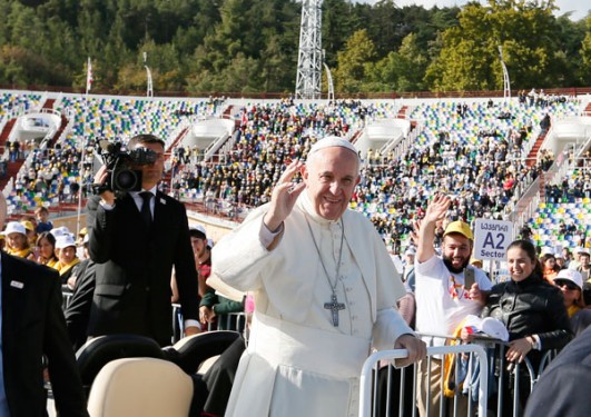 Pope Francis greets the crowd before celebrating Mass at Mikheil Meskhi Stadium in Tbilisi, Georgia, Oct. 1.