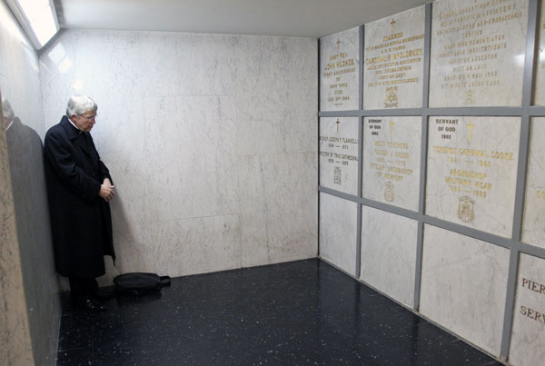Father Charles P. Connor prays before the tomb of Archbishop Fulton J. Sheen in the crypt of St. Patrick’s Cathedral in Manhattan in this 2009 photo. Father Connor, an assistant professor of church history at Mount St. Mary’s University, wrote the book “The Spiritual Legacy of Archbishop Fulton J. Sheen.” (Photo: Catholic News Service/ Gregory A. Shemitz)