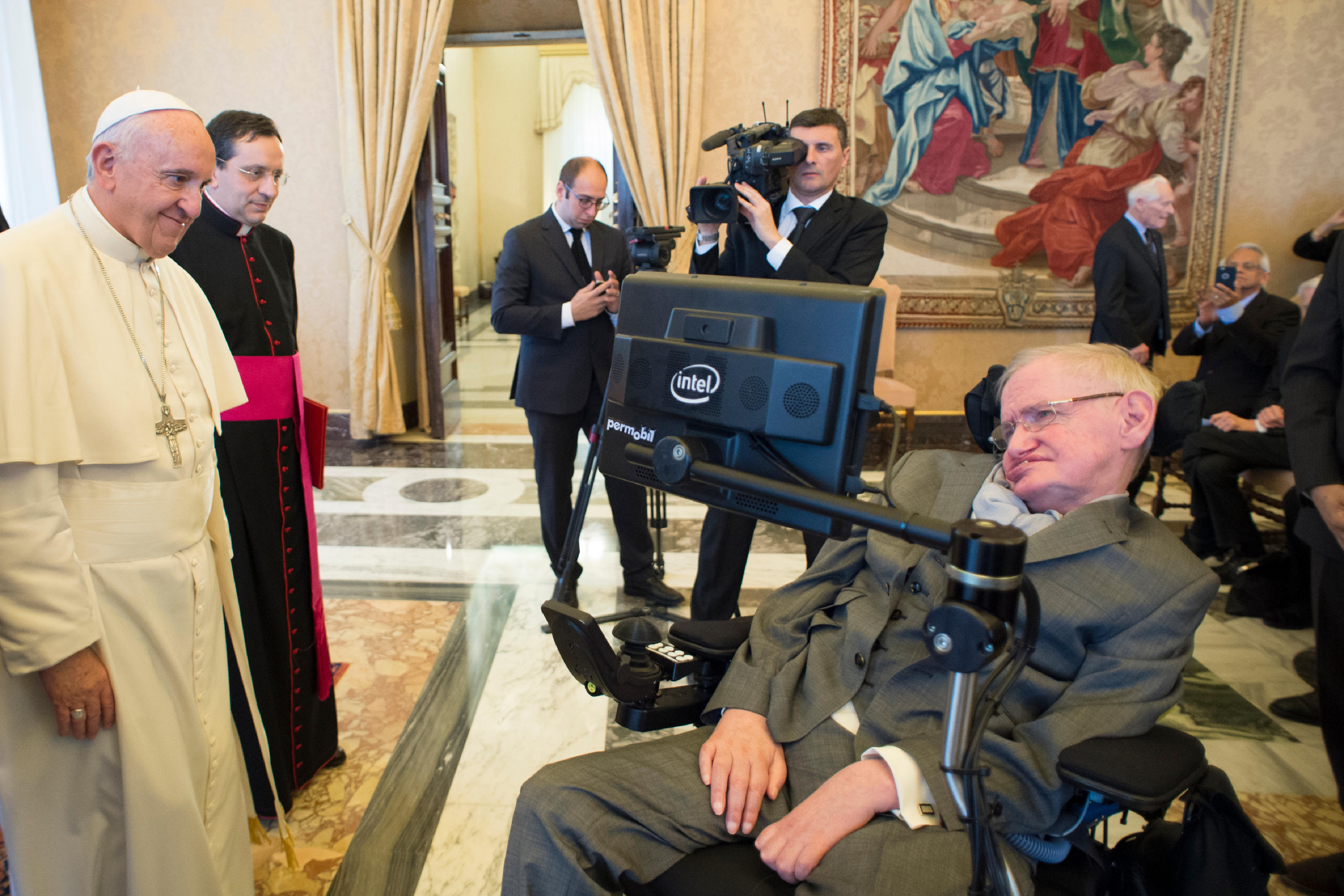Pope Francis greets British theoretical physicist and cosmologist Stephen Hawking, during an audience with participants attending a plenary session of the Pontifical Academy of Sciences at the Vatican Nov. 28. (CNS photo/L'Osservatore Romano, handout) See POPE-SCIENCE and POPE-DRUGS Nov. 28, 2016.