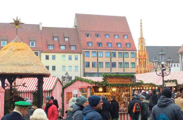People walk through the Christmas market in Nuremberg, Germany. Dating back to 1628, it is one of the oldest Christmas markets in Germany. (Photo: Catholic News Service/ Zita Fletcher) 