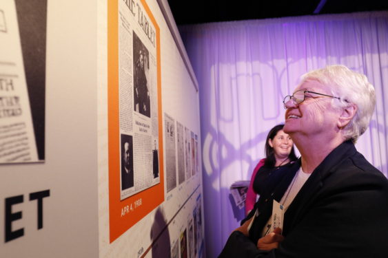 Sister Joan Curtin, C.N.D., director of the New York Archdiocesan Catechetical Office, enjoys the exhibit of historical Tablet front pages. Photo Greg Shemitz