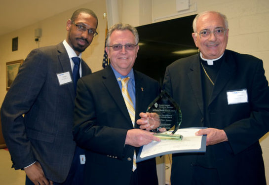 Deacon Rich Gilligan accepts for St. Mary Gate of Heaven, Ozone Park