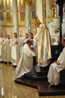 Bishop Nicholas DiMarzio lays hands on the head of Deacon Alfredo Castellanos.