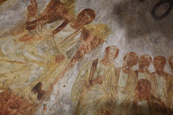 Jesus is seated on a throne with his disciples at his side in this fresco seen during the unveiling of two newly restored burial chambers in the Christian catacombs of St. Domitilla in Rome May 30.
