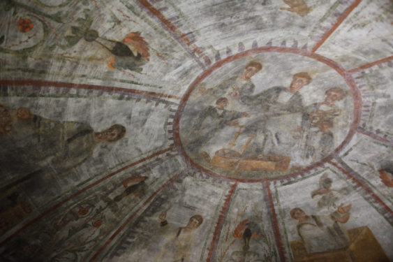 A fresco showing Noah releasing doves, lower right, and other scenes representing salvation are seen during the unveiling of two newly restored burial chambers in the Christian catacombs of St. Domitilla in Rome May 30.