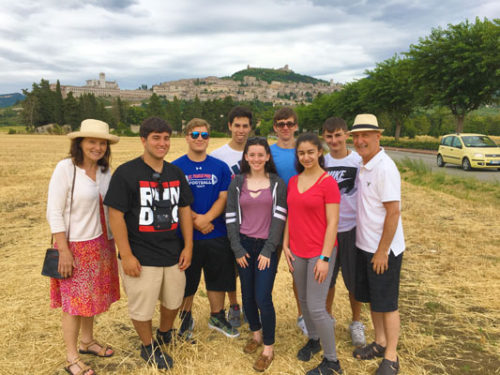 St. Francis Prep faculty member Dr. Stephen Marino, far right, his wife, far left, and his students explore Assisi, Italy.