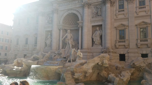 Throwing coins at the Trevi Fountain!