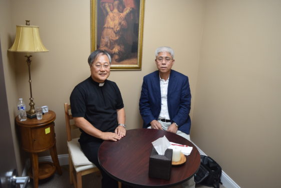  Father Andrew Kim, pastor of St. Paul Chong Hasang, Flushing, and parishioner Michael Choo, shared their feelings about the current situation in Korea. (Photo Matthew O’Connor)