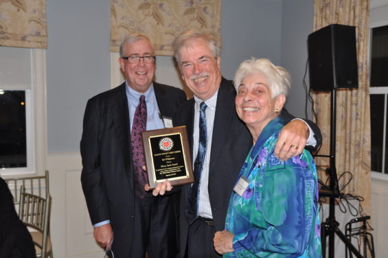 Wilkinson accepts the Mercy Spirit Award from Patrick Morgan, chairman of the Bennett Center board, and Sister Camille D’Arienzo, R.S.M., board member.