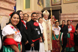 Immigrants Feel Strength in Numbers at Migration Mass