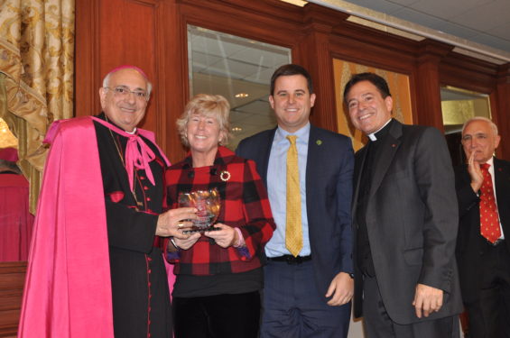 Bishop Nicholas DiMarzio and Msgr. Jamie Gigantiello present the Spirit of Hope Award to Patti Ann and Conor McDonald