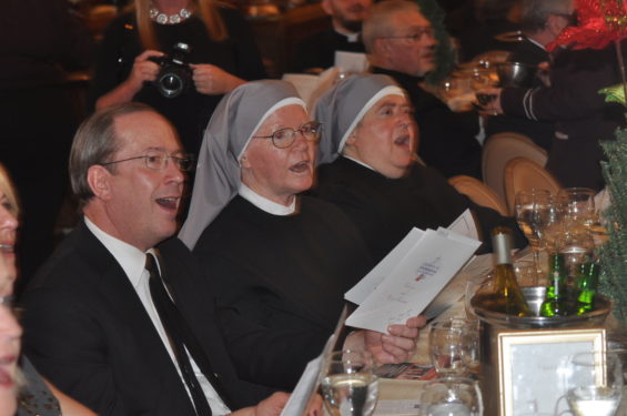  Little Sisters of the Poor from Queen of Peace Residence join in the caroling.