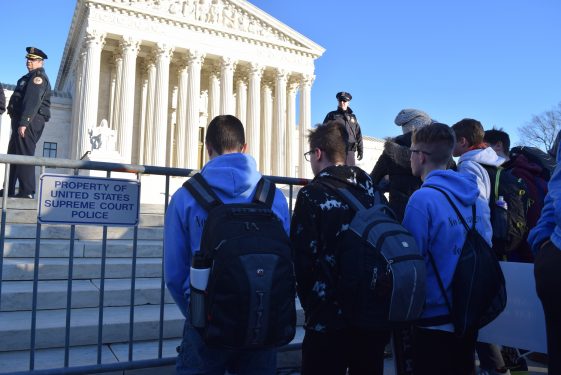 Students pause to pray outside the Supreme Court, where the infamous Roe v. Wade decision was handed down 45 years ago.