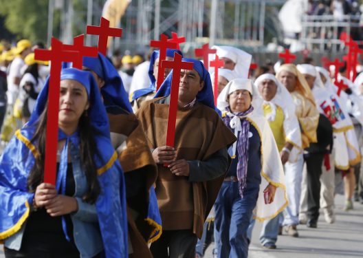 People carry crosses as they wait for Pope Francis' arrival at O'Higgins Park in Santiago, Chile, Jan. 16. (CNS photo/Paul Haring)