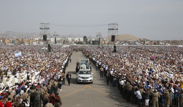 Pope Francis greets the crowd before  celebrating Mass at Las Palmas Air Base in Lima, Peru, Jan. 21. (CNS photo/Paul Haring) 