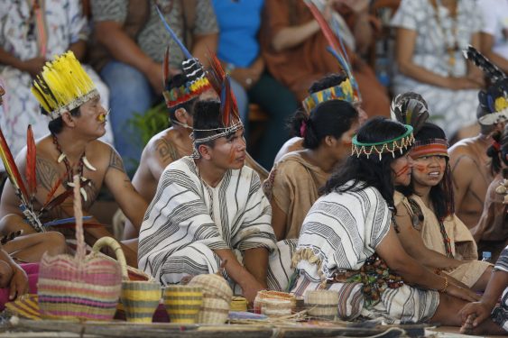 Members of an indigenous group from the Amazon region listen during a meeting with Pope Francis during a Jan. 19 meeting at Madre de Dios stadium in Puerto Maldonado, Peru. (CNS photo/Paul Haring)