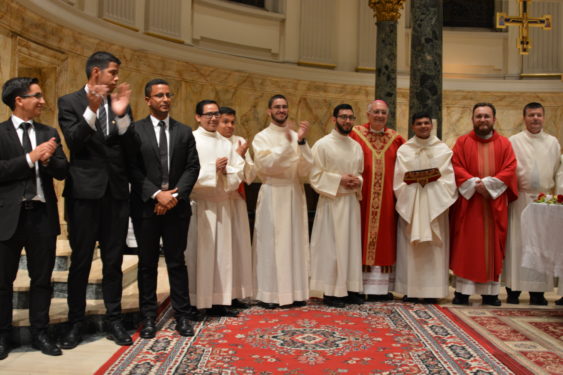 Bishop DiMarzio with the rector of the new seminary, Father Julio Cesar Sanchez Malagon, and eight of the 12 young men who are going to study for the priesthood in the new house of formation, Redemptoris Mater Seminary.