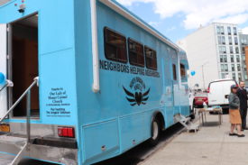 Wheels on the Bus Bring Food to the Area’s Needy