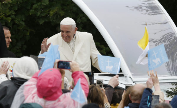 Pope Francis greets the crowd as he visits the Knock Shrine in Knock, Ireland, Aug. 26. (CNS photo/Paul Haring) 