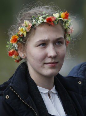 A young woman attends Pope Francis' celebration of Mass Sept. 24 at the Shrine of the Mother of God in Aglona, Latvia. (CNS photo/Paul Haring)
