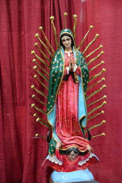 a statue of Our Lady of Guadalupe at one of the exhibit booths.