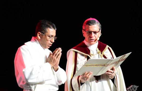 Archbishop Gustavo Garcia-Siller of San Antonio, Texas, right, leads the opening prayer at V Encuentro