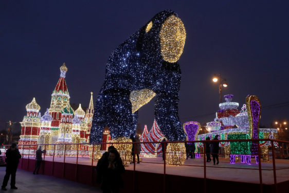 People gather near a light display Dec. 17 ahead of Christmas in Moscow. (CNS photo/Tatyana Makeyeva, Reuters)