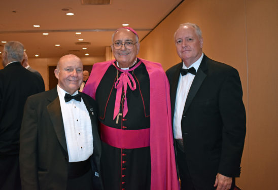 At this year’s Cathedral Club dinner, Bishop Nicholas DiMarzio, center, is seen with Cathedral Club President Brian Long and Craig Eaton, dinner co-chair, and former Kings County Republican Chairman and NYS GOP Vice Chair. (Photo Salles Gallery)