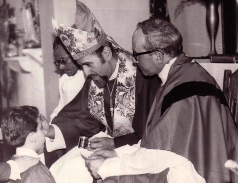 Bishop Valero confirms a young man in 1988 at Epiphany Church, Williamsburg.