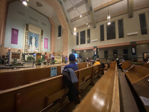 Guests sat socially distanced in pews and wore masks during the sixth day of the Simbang Gabi novena Mass at Our Lady of Lourdes Church, Queens Village, Dec. 20. The nine-day novena ends on Dec. 24. 
