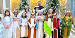 Catholic School Students Sing, Reenact Nativity Scene