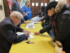 Tablet Readers Line Up for Book Highlighting History of Diocese