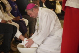 Bishop Brennan Commemorates Last Supper by Washing Feet of 12 People