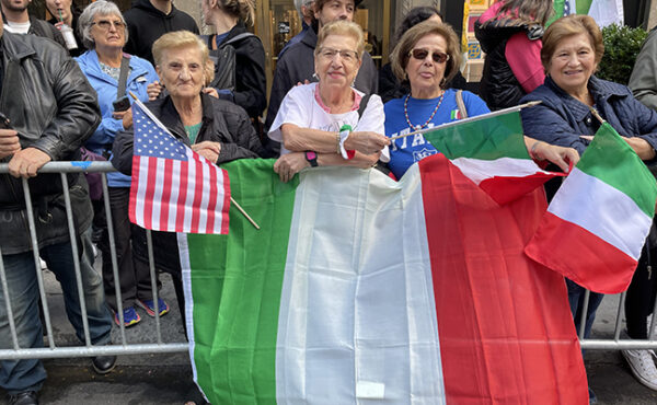 Spectators lining Fifth Avenue got into the spirit of the day by waving and displaying Italian flags. (Photo: Paula Katinas)