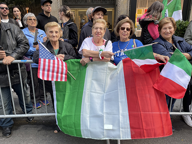 Spectators lining Fifth Avenue got into the spirit of the day by waving and displaying Italian flags. (Photo: Paula Katinas)