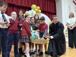 With Suitcase Yet Unpacked in Queens, New Pastor Father Christopher Heanue Raises $208,000 for St. Joan of Arc School Scholarships