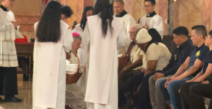 Bishop Robert Brennan Washes Feet of 12 During Mass of the Lord’s Supper in Brooklyn
